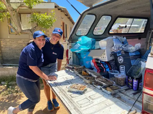 Volunteers feeding dogs in an underserved community